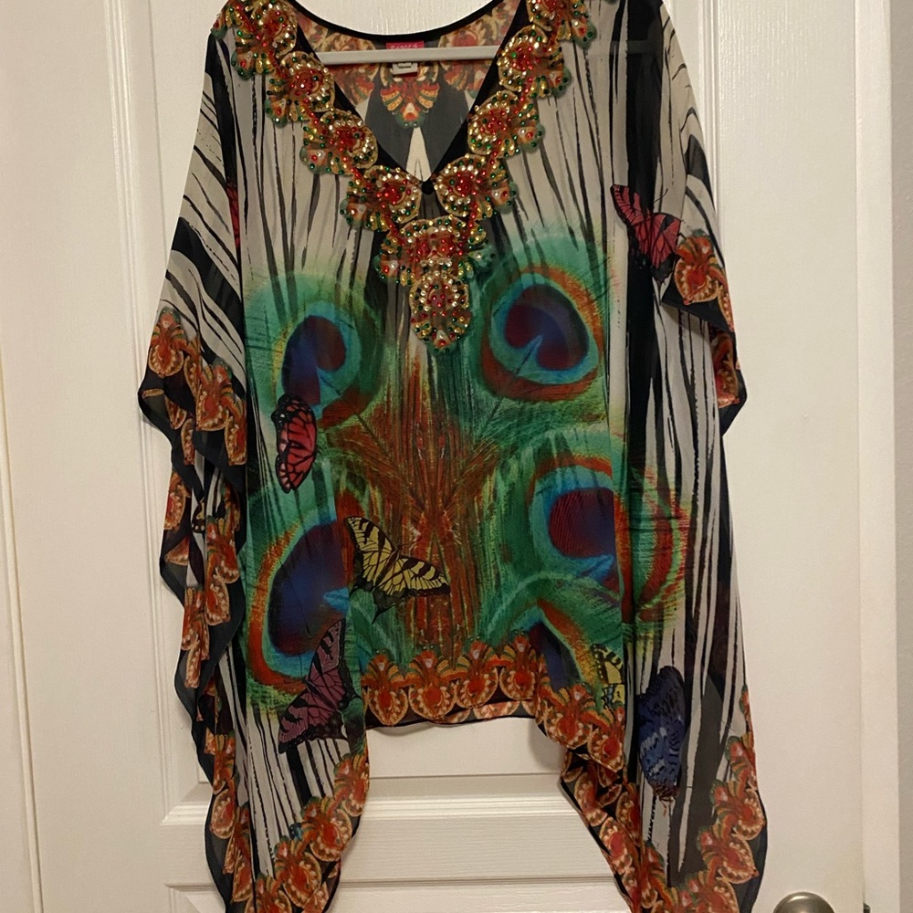 Tunic or swimsuit coverup, either way is glamorous. Ranee’s brand